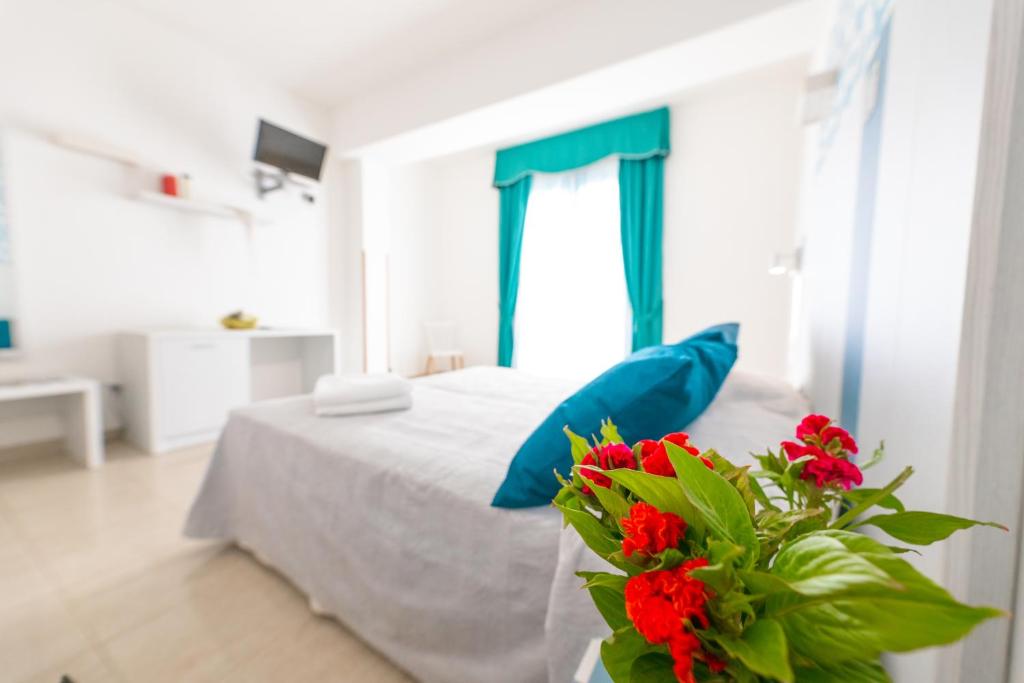 Postel nebo postele na pokoji v ubytování Hotel Magna Grecia