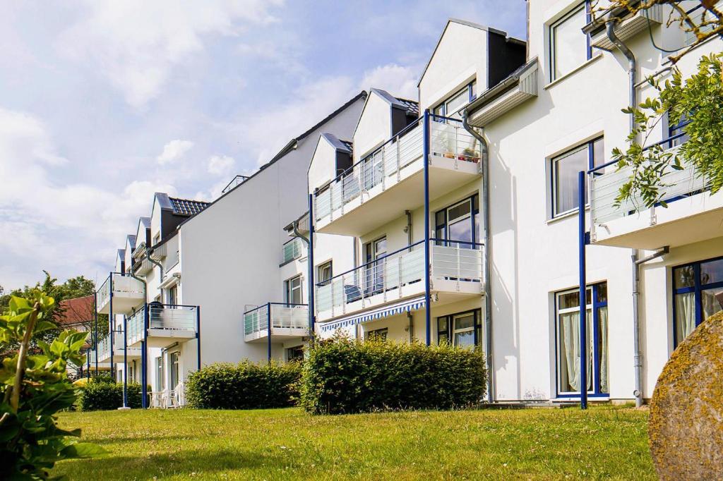 a row of white apartment buildings with balconies at Apartment in Boltenhagen near the sea in Boltenhagen