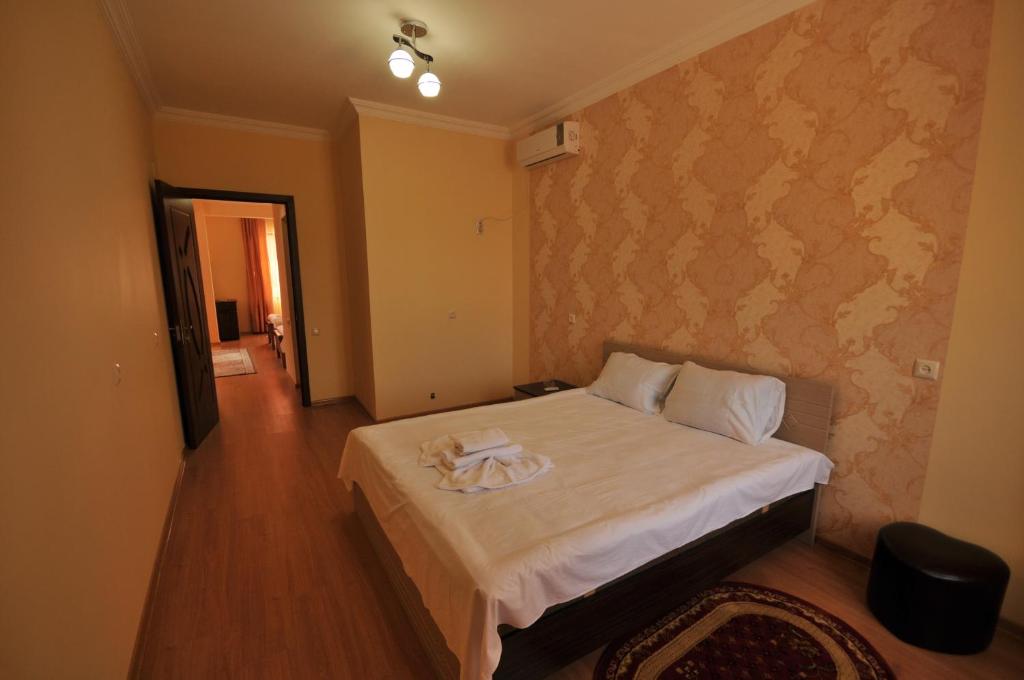Postel nebo postele na pokoji v ubytování Marani Hotel