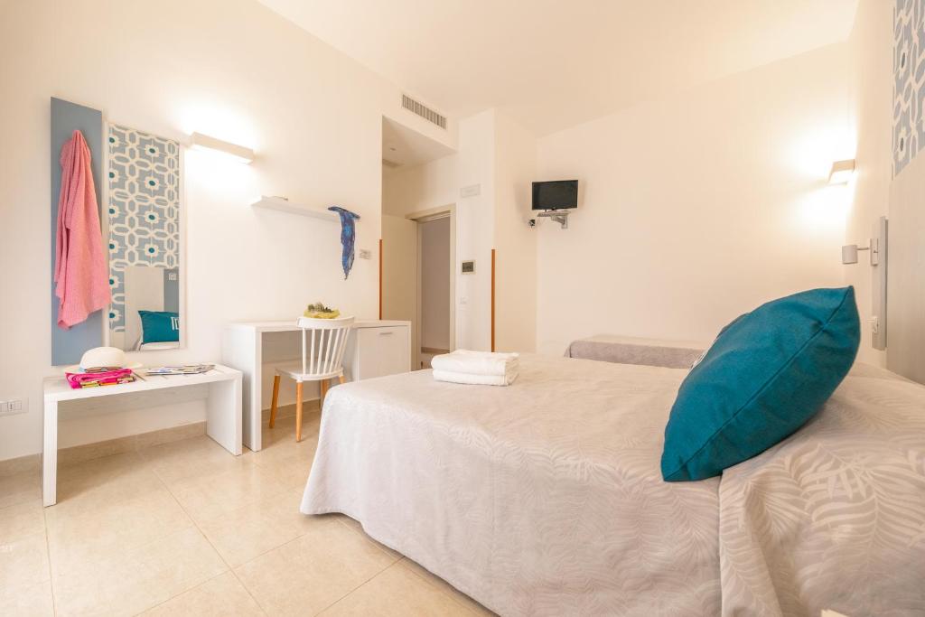 Postel nebo postele na pokoji v ubytování Hotel Magna Grecia
