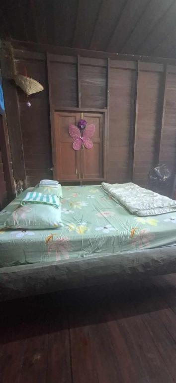 Postel nebo postele na pokoji v ubytování Garden House INChiangrai