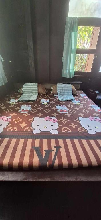 Postel nebo postele na pokoji v ubytování Garden House INChiangrai