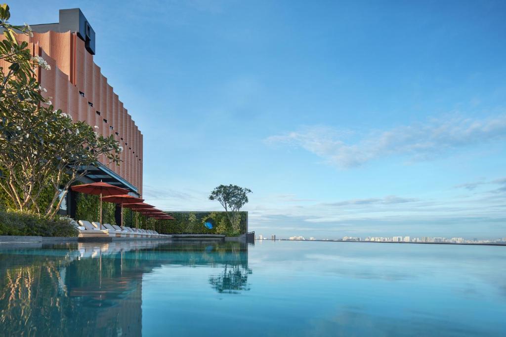 a large body of water next to a building at Artyzen Singapore in Singapore