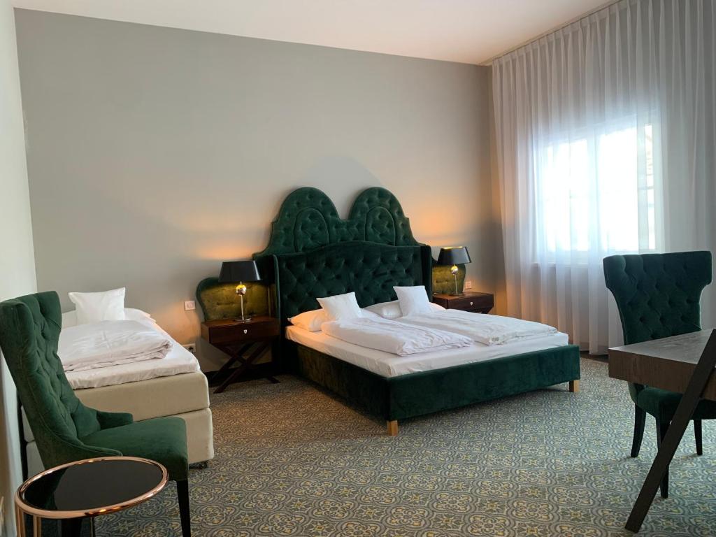 Postel nebo postele na pokoji v ubytování Pałac na Wodzie Hotel & SPA
