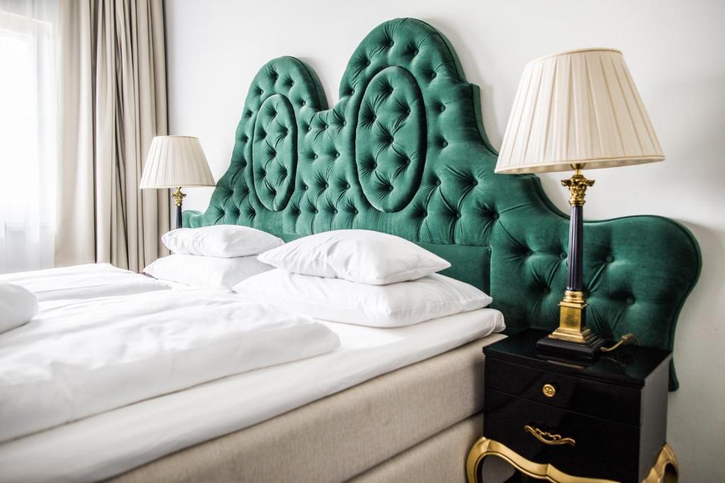 Postel nebo postele na pokoji v ubytování Pałac na Wodzie Hotel & SPA