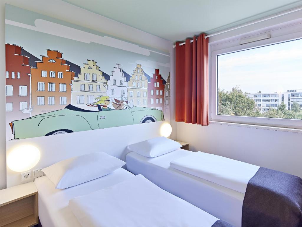 Postel nebo postele na pokoji v ubytování B&B Hotel Osnabrück