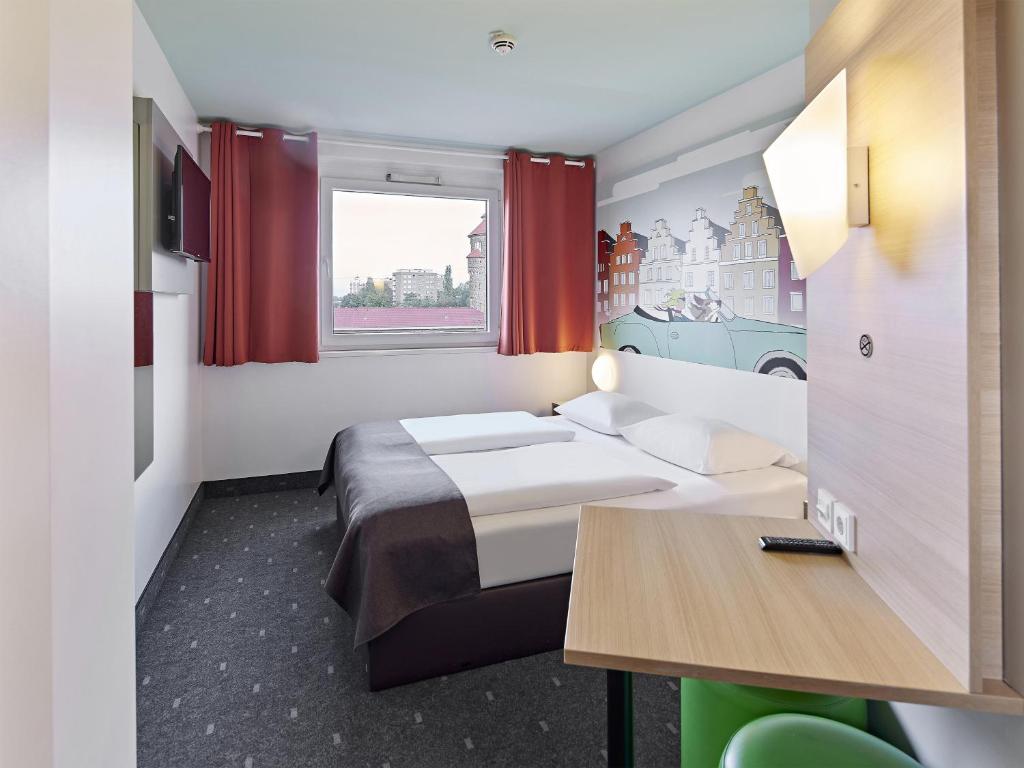 Postel nebo postele na pokoji v ubytování B&B Hotel Osnabrück