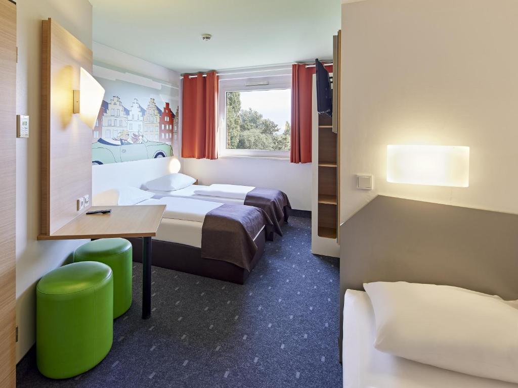 Postel nebo postele na pokoji v ubytování B&B Hotel Osnabrück