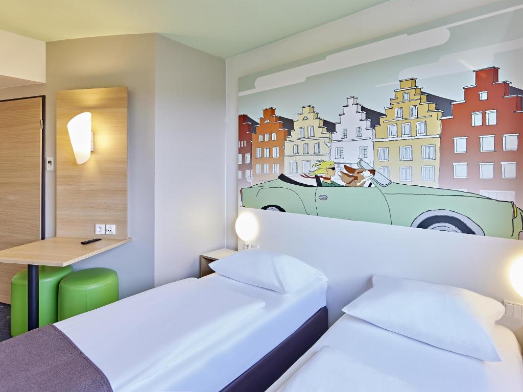 Postel nebo postele na pokoji v ubytování B&B Hotel Osnabrück