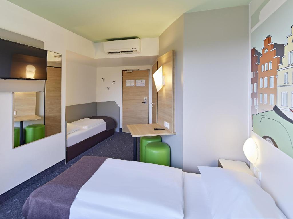 Postel nebo postele na pokoji v ubytování B&B Hotel Osnabrück
