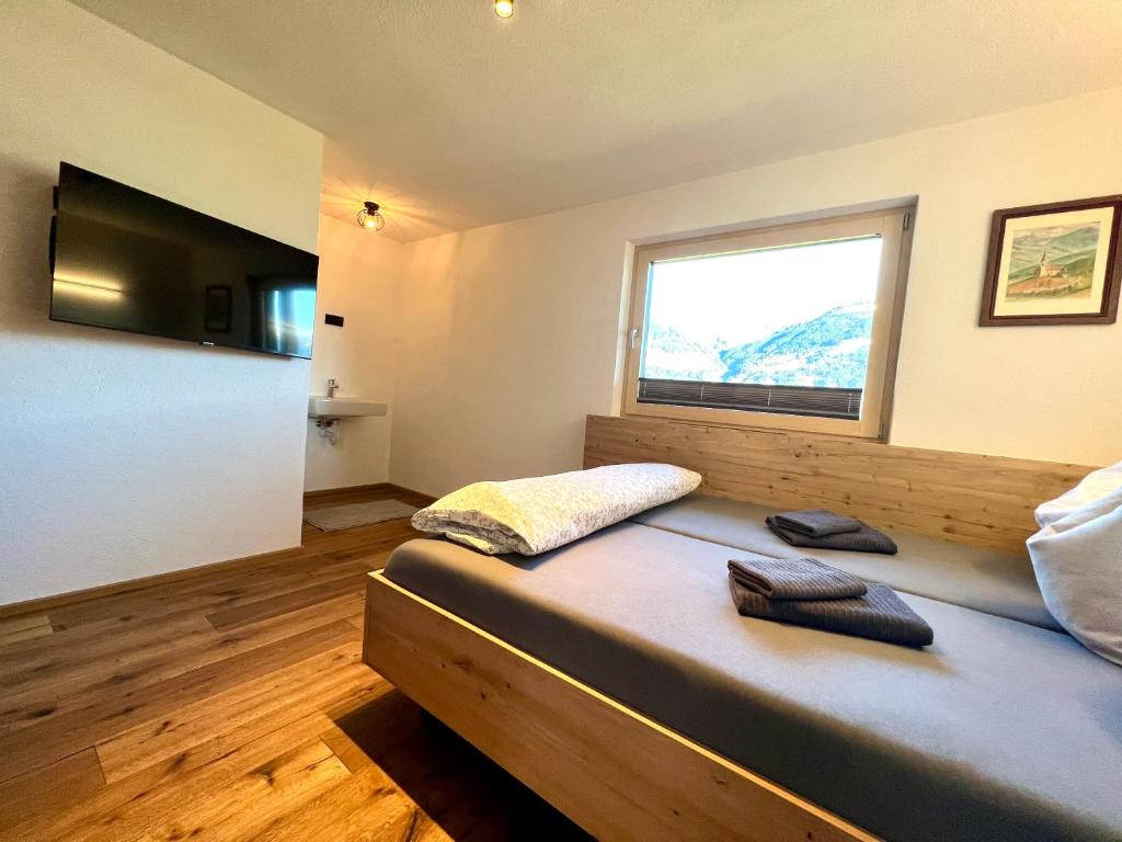TV a/nebo společenská místnost v ubytování Appartement Hirner
