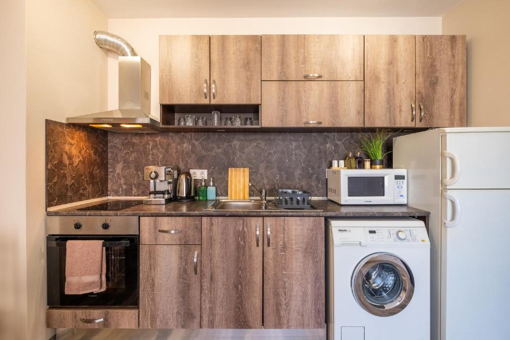 Kuchyň nebo kuchyňský kout v ubytování Cozy Homes 1