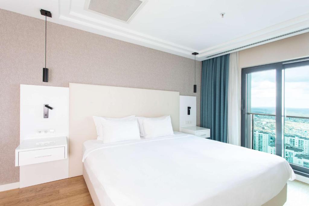 Radisson Residences Avrupa TEM Istanbulにあるベッド