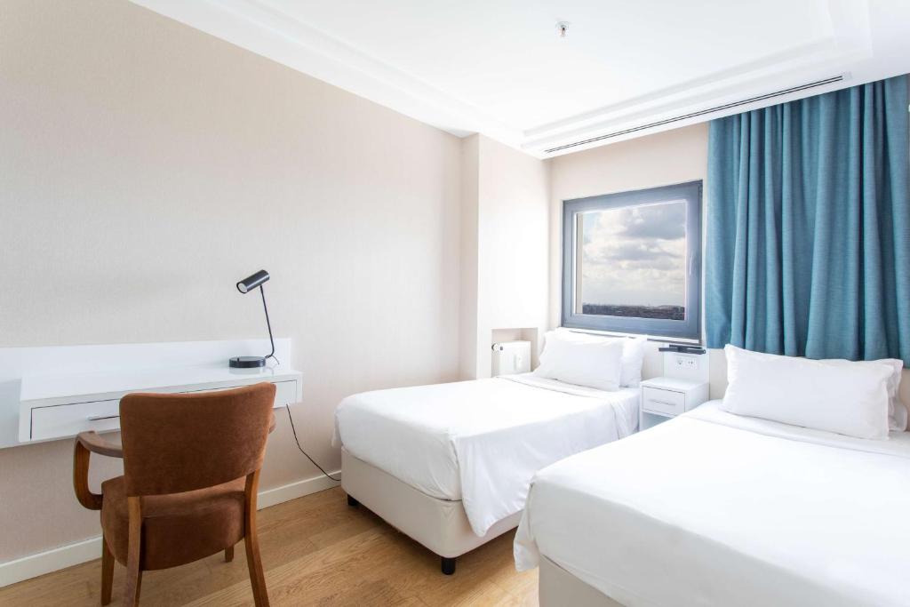Radisson Residences Avrupa TEM Istanbulにあるベッド