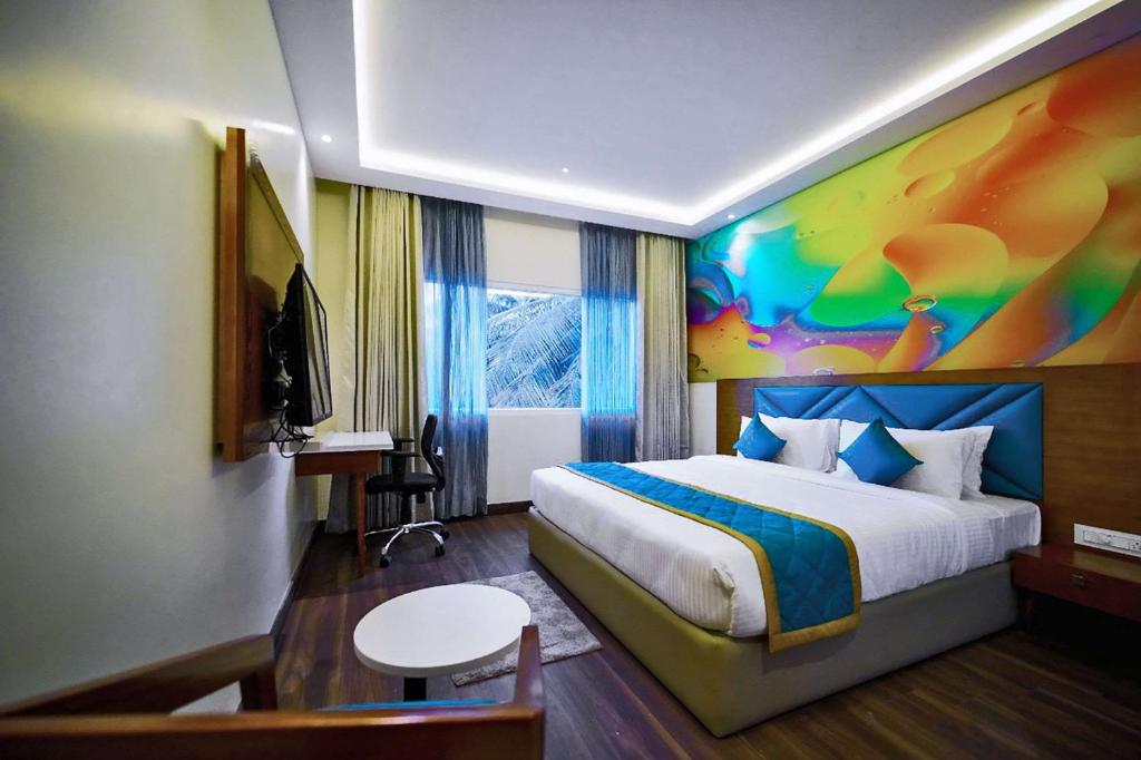 Postel nebo postele na pokoji v ubytování Quality Inn Rockwell Grand, Bangalore