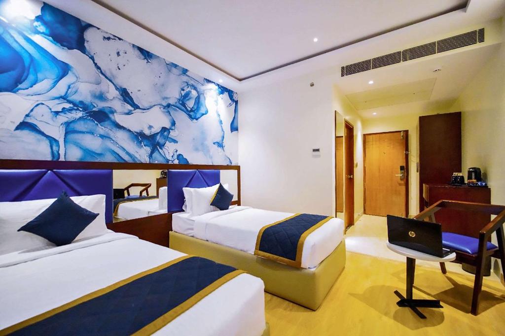 Postel nebo postele na pokoji v ubytování Quality Inn Rockwell Grand, Bangalore