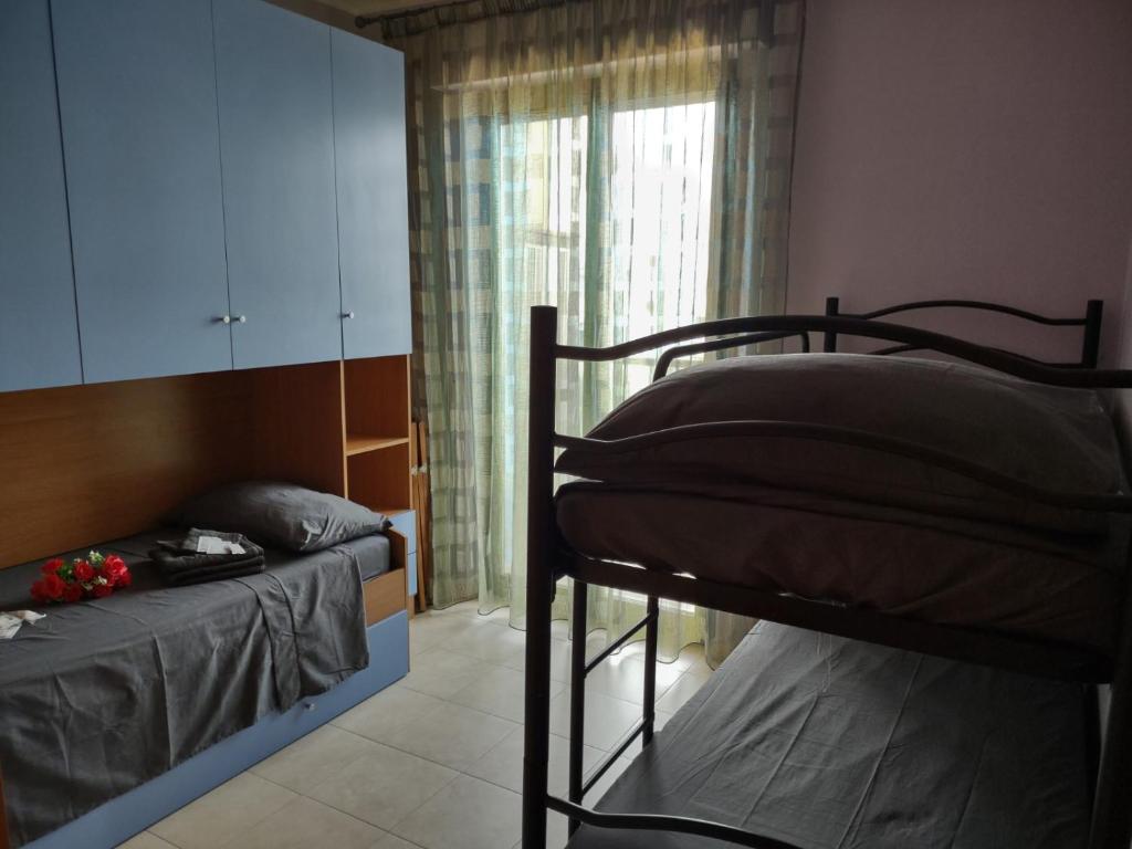 Posteľ alebo postele v izbe v ubytovaní Selida Aquamarine House