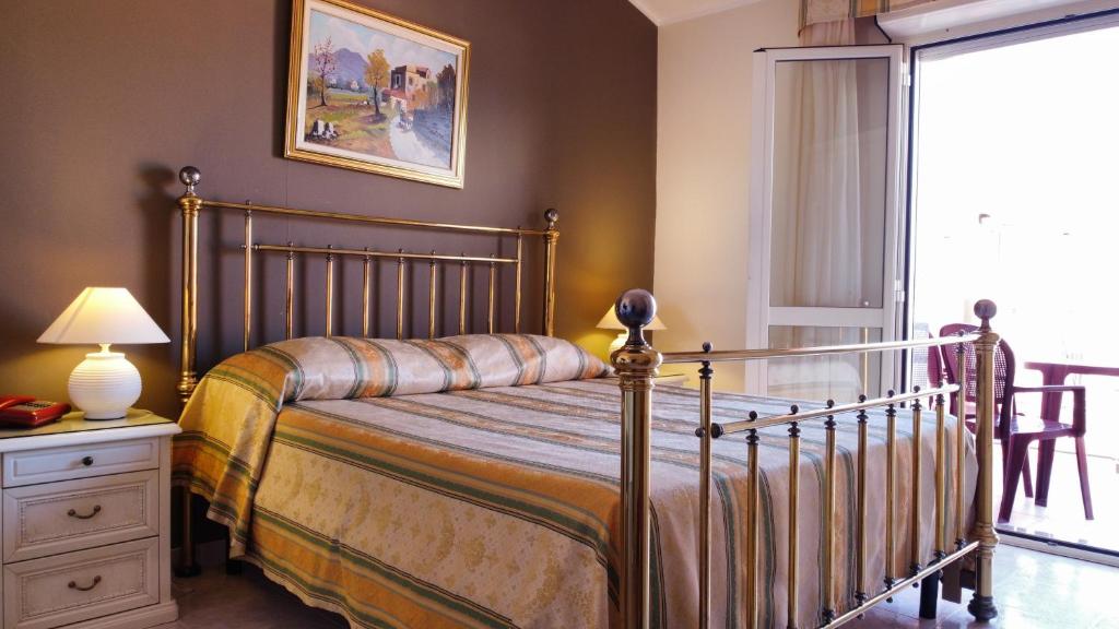 Postel nebo postele na pokoji v ubytování Hotel San Marco