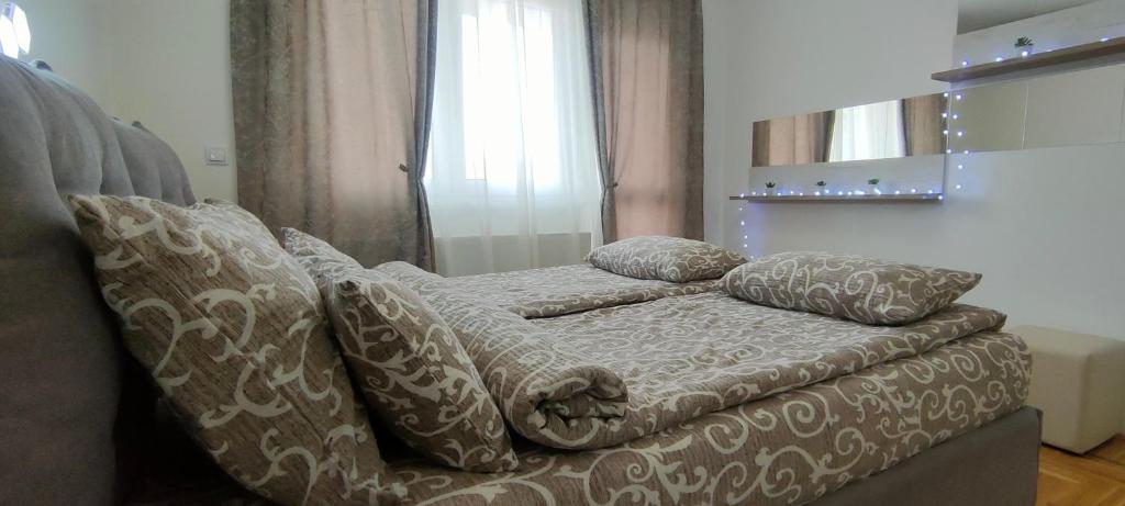 Postel nebo postele na pokoji v ubytování Apartman Ema