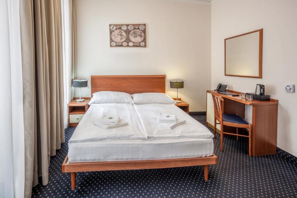 Postel nebo postele na pokoji v ubytování Hotel Europa