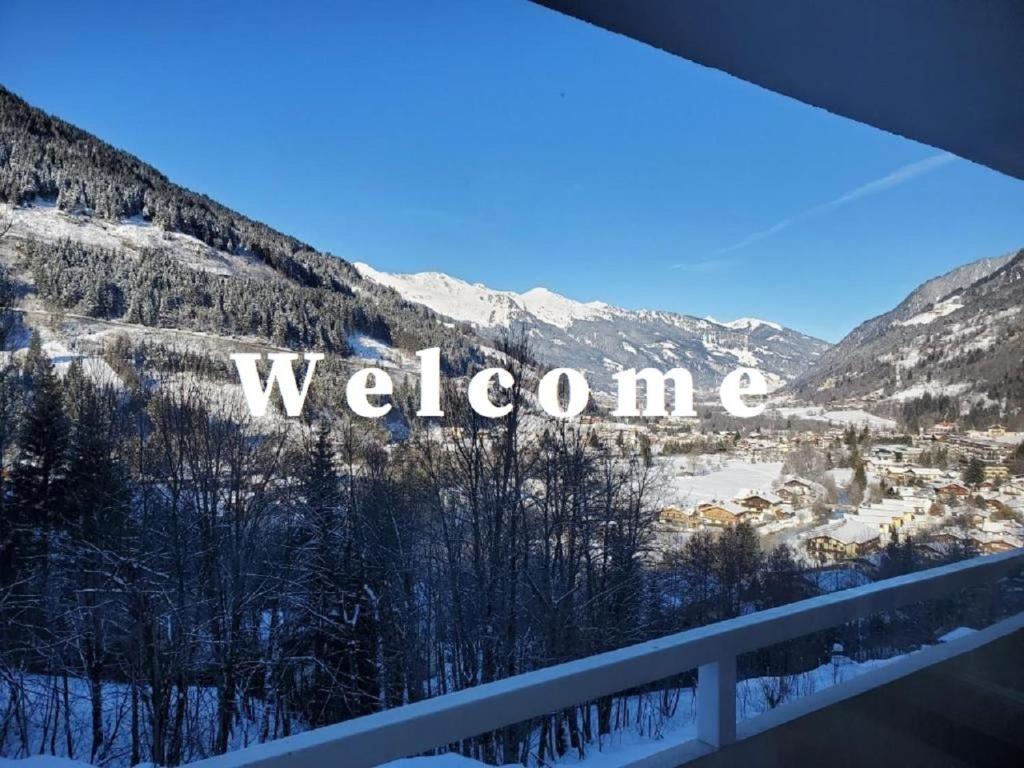 a view of a snowy mountain with the word welcome at Appartement Ferienregion Bad Gastein in Bad Gastein