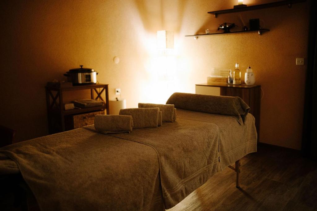 a bedroom with a bed with two pillows on it at Alpine Hotel Perren in Zermatt