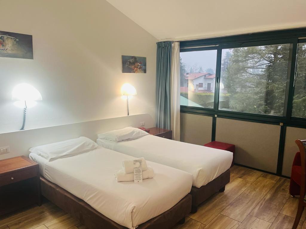 Postel nebo postele na pokoji v ubytování Green Hotel Motel