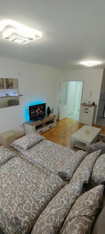 Postel nebo postele na pokoji v ubytování Apartman Ema