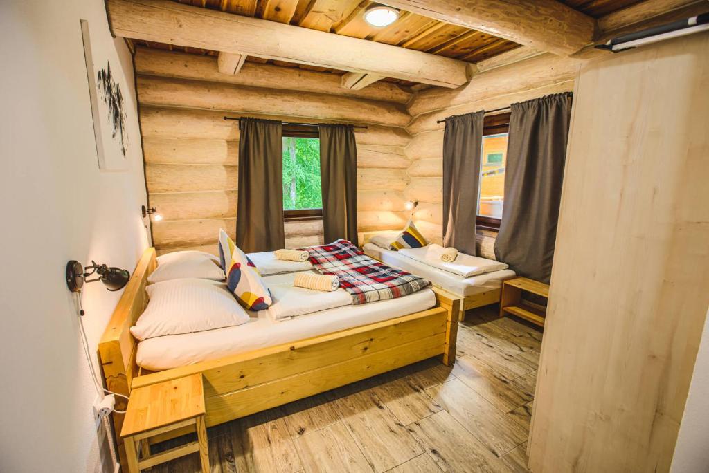 Postel nebo postele na pokoji v ubytování Zruby Pod Chopkom
