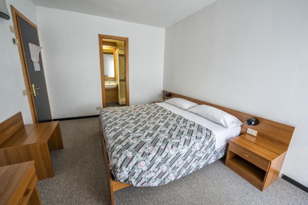 Łóżko lub łóżka w pokoju w obiekcie Hotel Drago