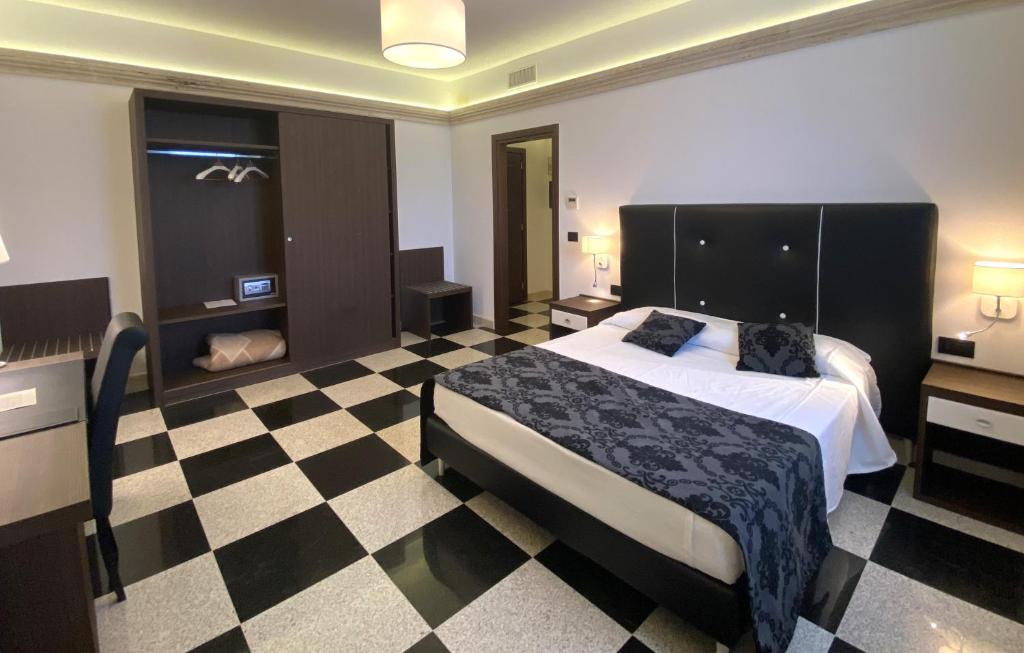Postel nebo postele na pokoji v ubytování BHB Hotel