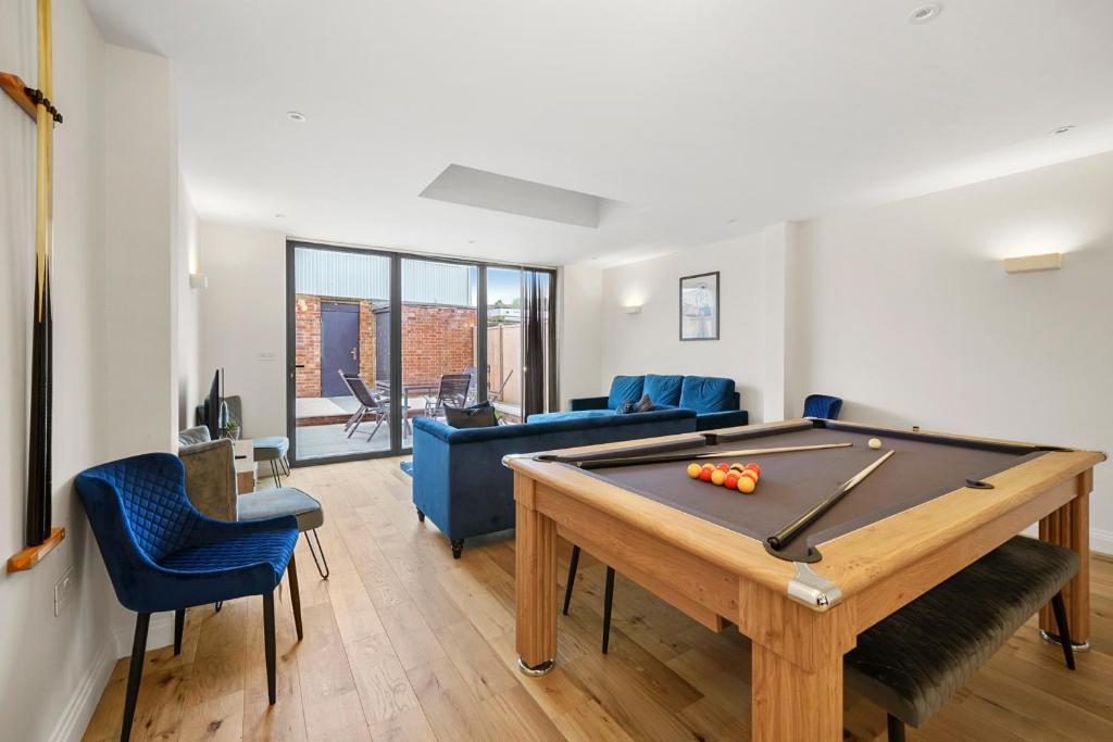 a living room with a pool table and a couch at Deluxe 5 Bed House in London - Pool Table in West Dulwich