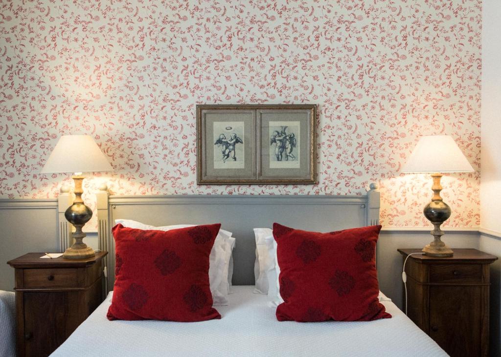 Postel nebo postele na pokoji v ubytování Demeure Castel Brando Hôtel & Spa