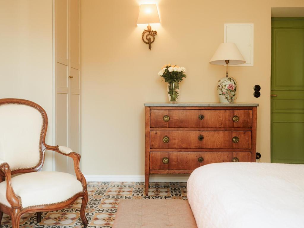 Postel nebo postele na pokoji v ubytování Demeure Castel Brando Hôtel & Spa