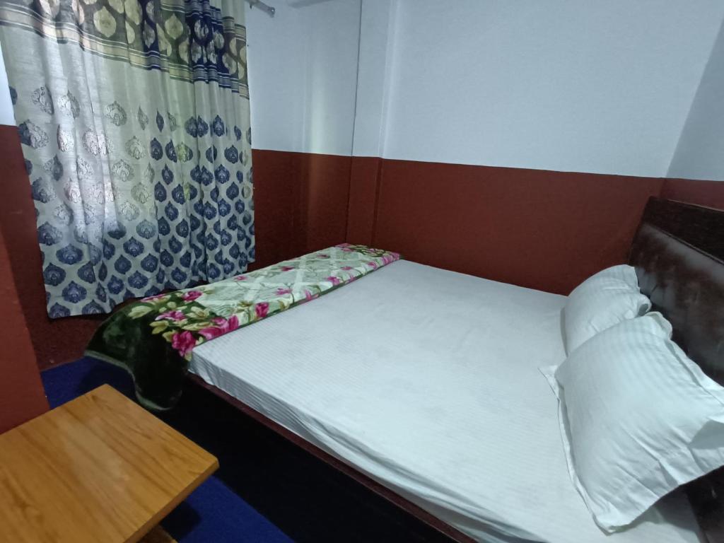 Postel nebo postele na pokoji v ubytování Hotel Sai Aman