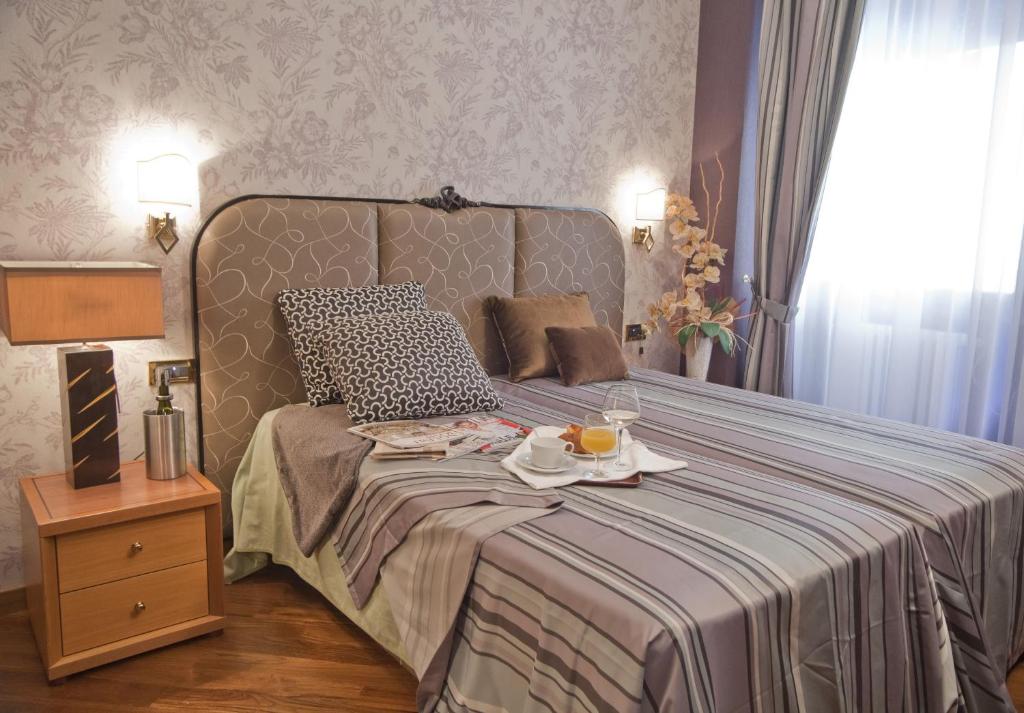 Postel nebo postele na pokoji v ubytování Hotel Europa