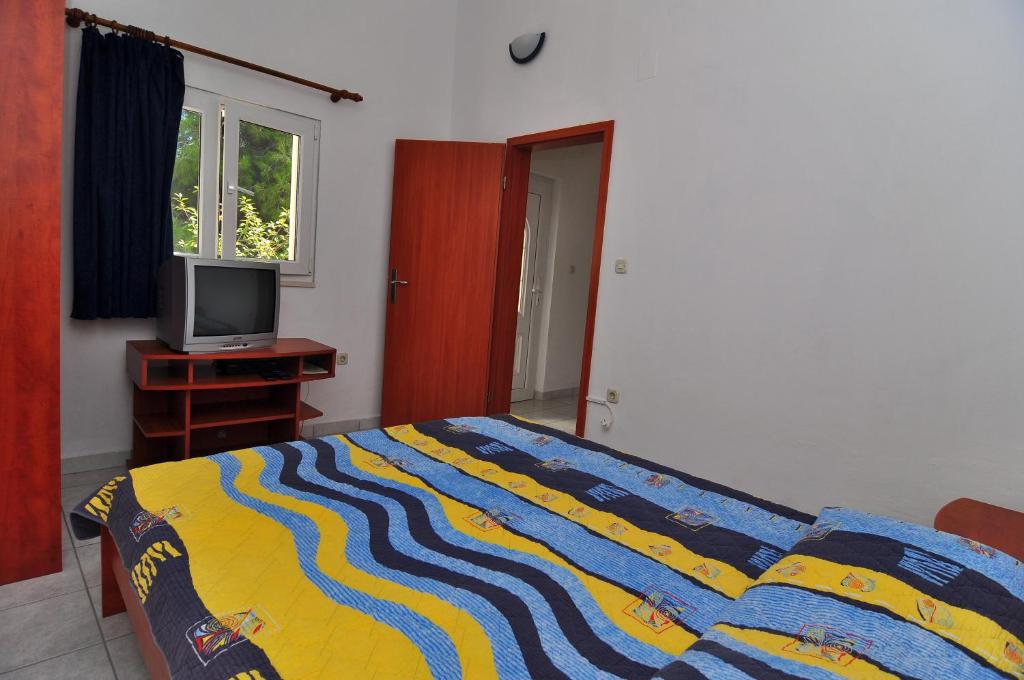 Łóżko lub łóżka w pokoju w obiekcie Apartments Livia