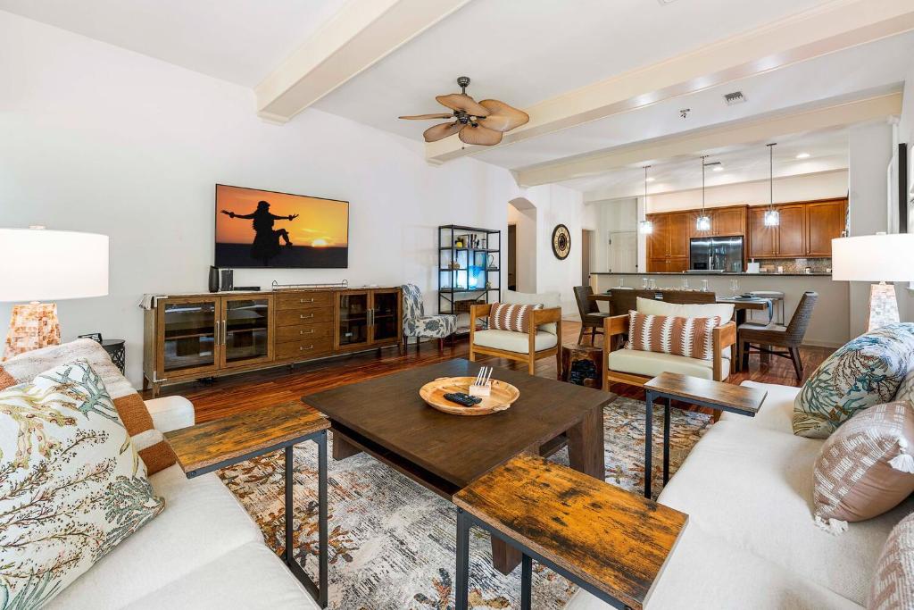 a living room with a couch and a table at Mauna Lani Fairways 302 in Waikoloa