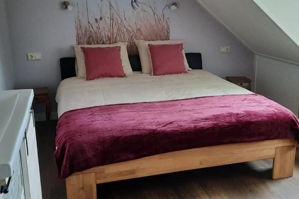 Postel nebo postele na pokoji v ubytování B&B de Zilverreiger