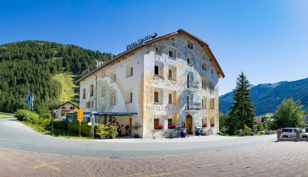 a large building in the middle of a road at Hotel Central La Fainera Superior in Valchava