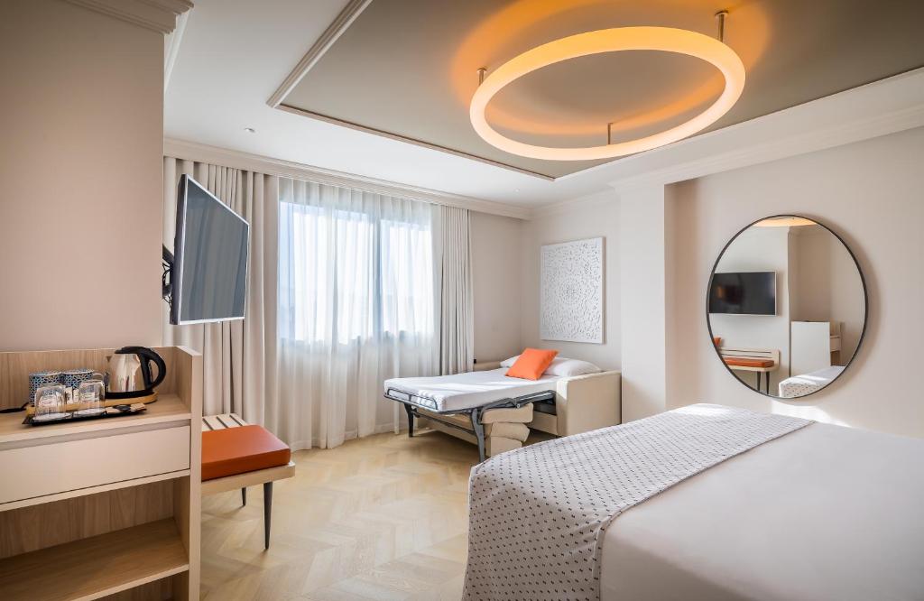 Postel nebo postele na pokoji v ubytování Barceló Carmen Granada