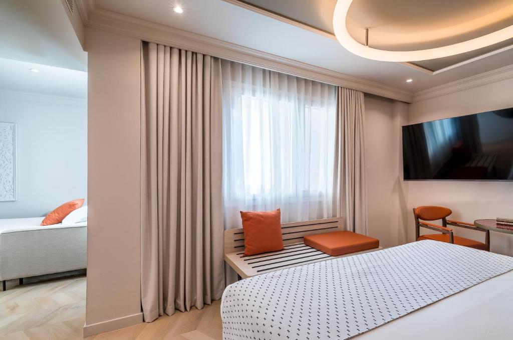 Postel nebo postele na pokoji v ubytování Barceló Carmen Granada