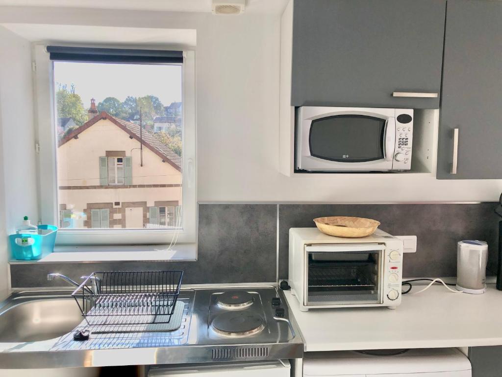 Kuchyň nebo kuchyňský kout v ubytování Studio indépendant confortable