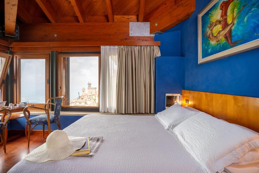 Postel nebo postele na pokoji v ubytování Hotel Cesare