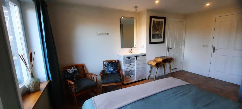Postel nebo postele na pokoji v ubytování B&B de Zilverreiger