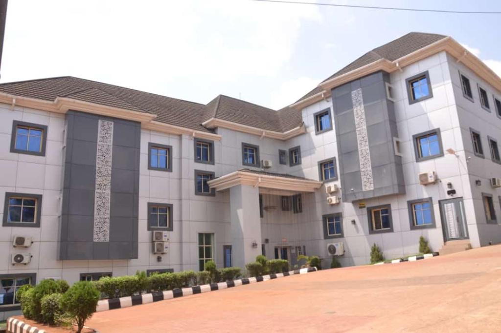 a large building with a lot of windows at Rizz Park Hotel & Event Center in Nnewi
