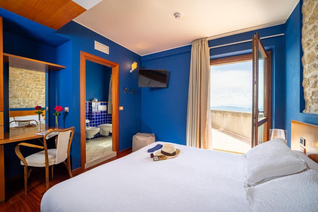Postel nebo postele na pokoji v ubytování Hotel Cesare