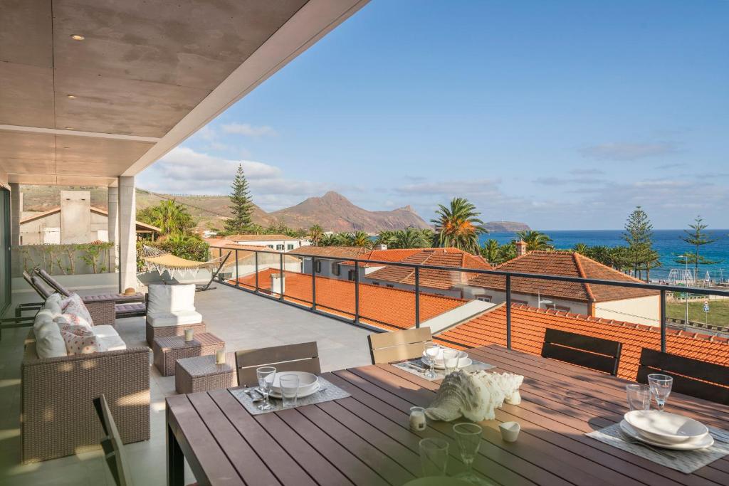 a balcony of a house with a view of the ocean at Casa da Maresia by An Island Apart in Porto Santo
