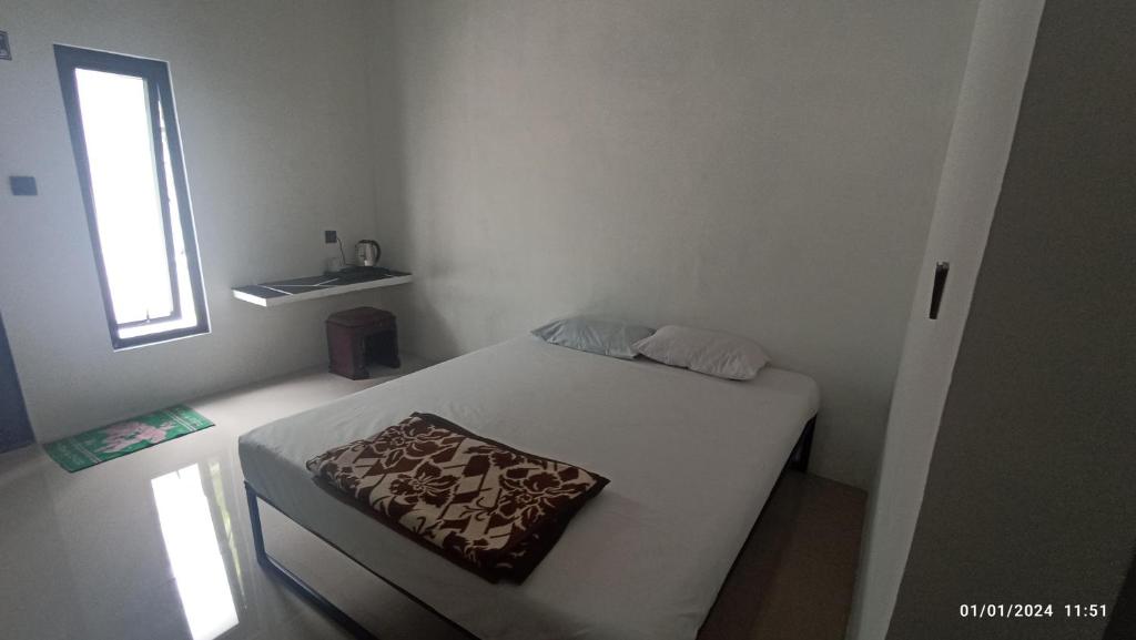 A bed or beds in a room at ARIRANG27 HOMESTAY