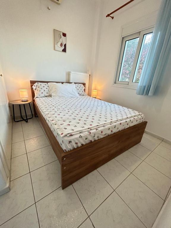 Ένα ή περισσότερα κρεβάτια σε δωμάτιο στο Our Home